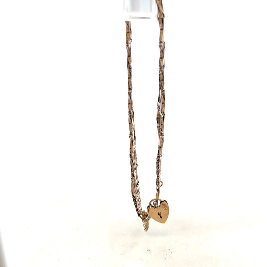 9ct yellow gold gate bracelet, unbranded, with a 7.4g weight, showcasing a classic chain link design.