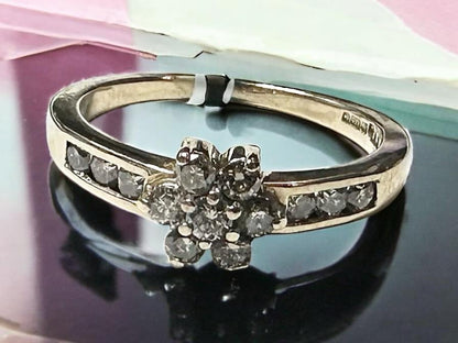 9ct yellow gold half-carat diamond ring in size M, featuring a sleek band and sparkling diamond accent.