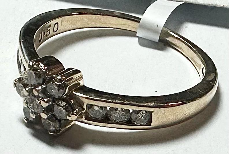 9ct yellow gold diamond ring with half-carat stone, size M, unbranded, showcasing a sleek and elegant jewelry design.