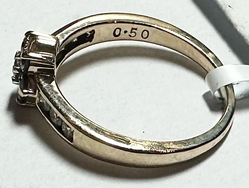 9ct yellow gold half-carat diamond ring in size M, featuring a sparkling diamond set in a sleek gold band.