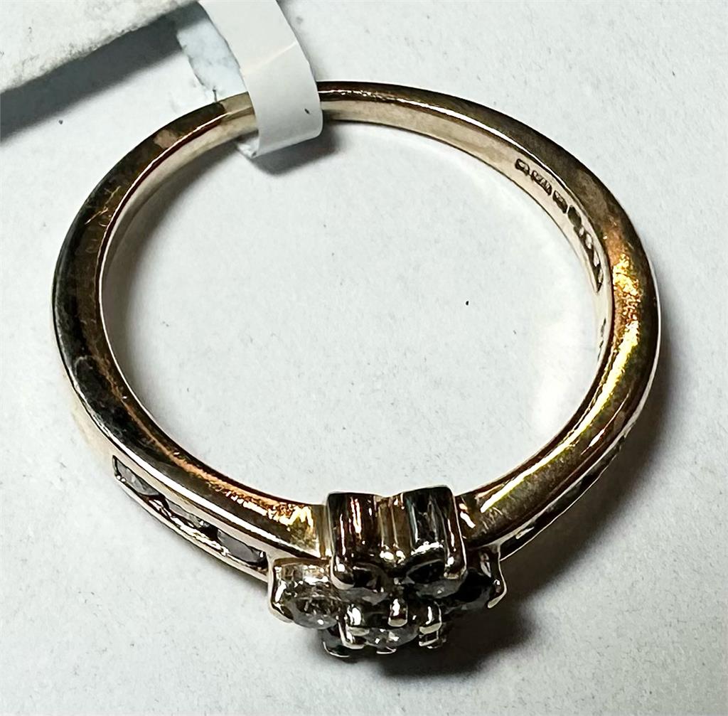 9ct yellow gold half-carat diamond ring in size M, showcasing a sparkling diamond accent on a sleek gold band.