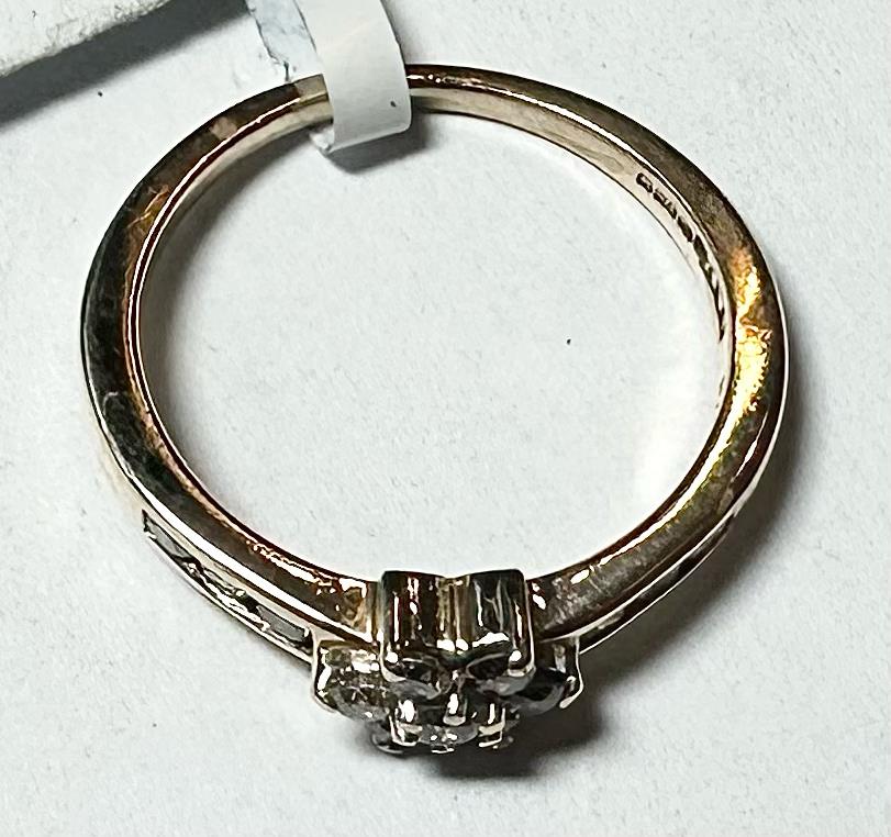 9ct yellow gold half-carat diamond ring in size M, featuring a sleek band and sparkling diamond accent.