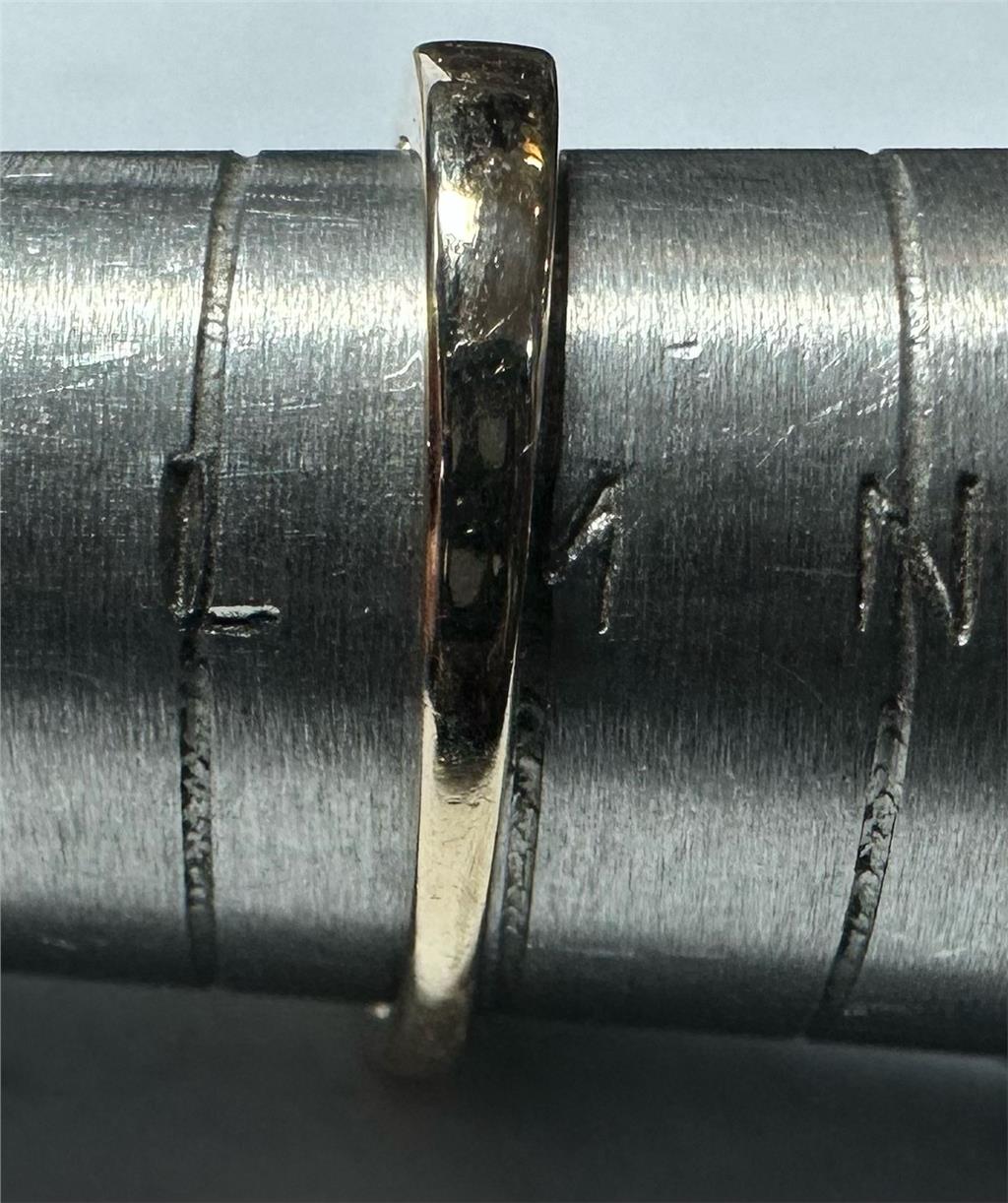 Yellow gold half-carat diamond ring in size M, unbranded, featuring a classic design and sparkling diamonds on a sleek band.