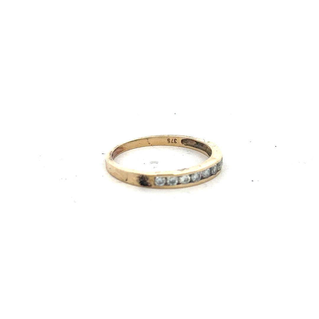 9ct yellow gold half eternity diamond ring in size N, featuring a row of sparkling diamonds on a sleek gold band.
