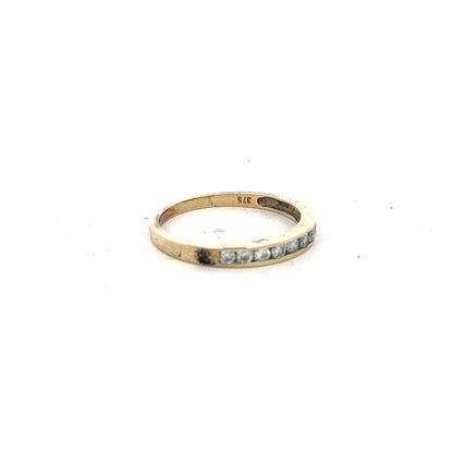 9ct yellow gold half eternity diamond ring in size N, featuring a row of sparkling diamonds on a sleek gold band.