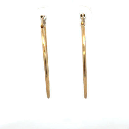 9ct yellow gold hoop earrings with a sleek, classic design, weighing 1.1g, suitable for everyday wear.