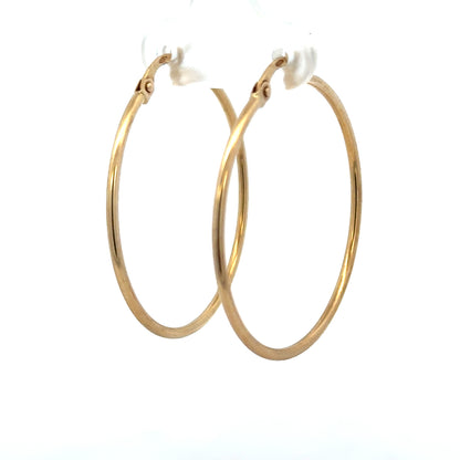 9ct yellow gold hoop earrings, unbranded, lightweight 1.1g, classic round design, shiny finish, suitable for everyday wear.
