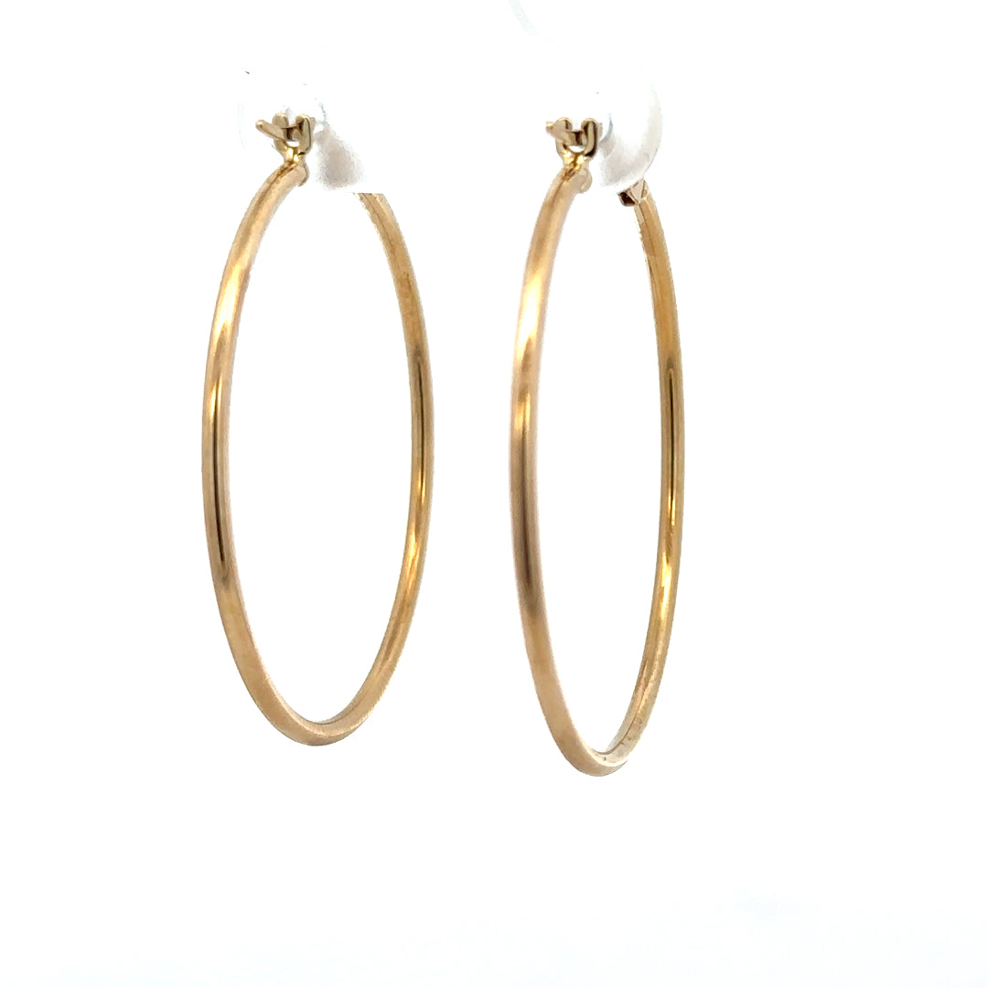 9ct yellow gold hoop earrings weighing 1.1g, unbranded, featuring classic round design with a polished finish.