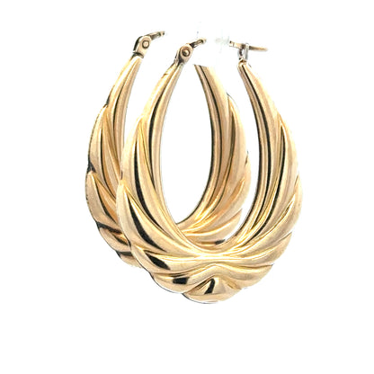 9ct yellow gold hoop earrings, lightweight and classic, with a smooth polished finish, shown on a plain background.