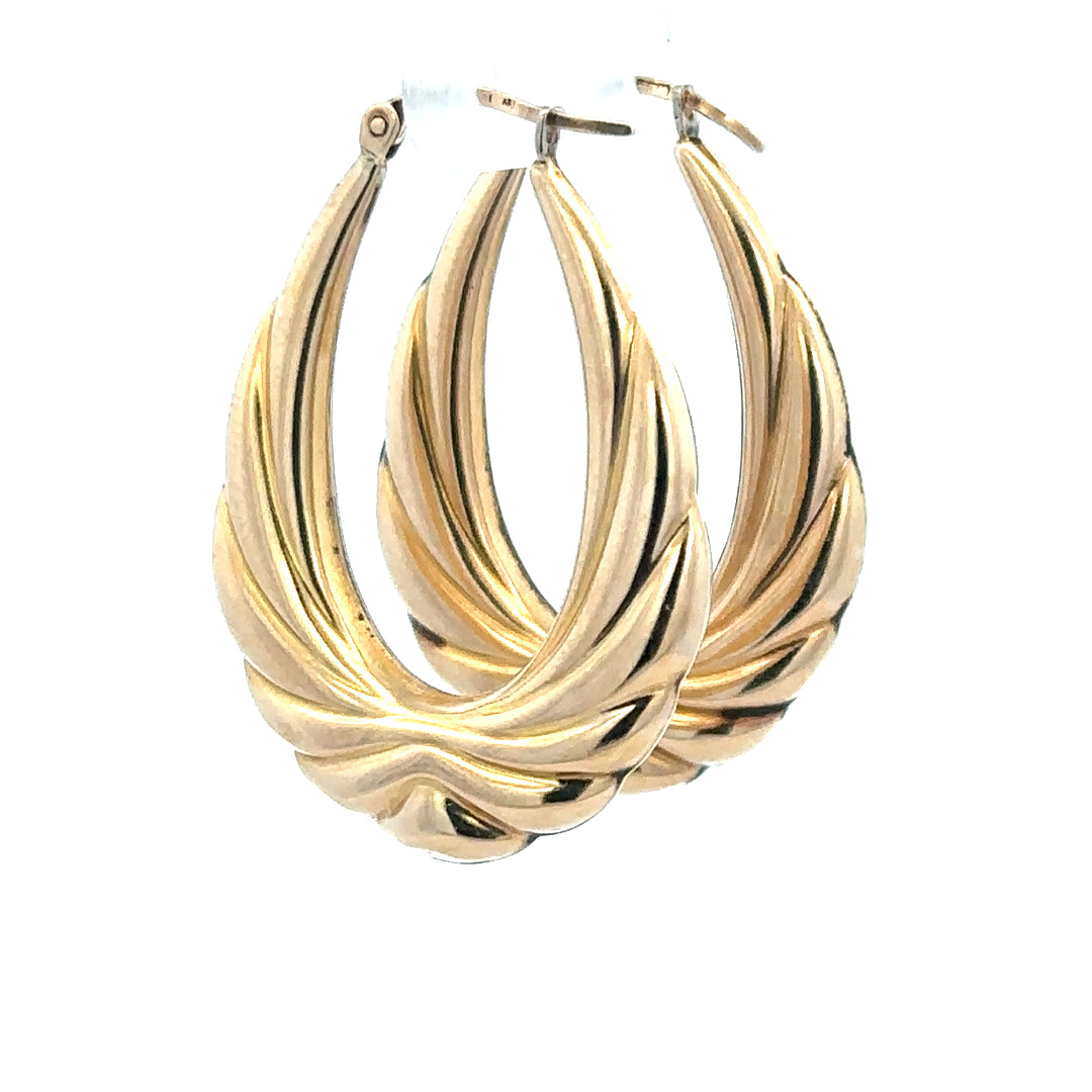 9ct yellow gold hoop earrings weighing 3.8g, unbranded, shown with a classic round design and polished finish.