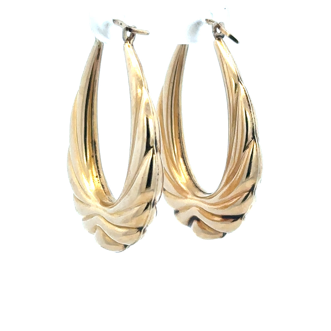 9ct yellow gold hoop earrings with a polished finish, weighing 3.8g, featuring a classic round design for everyday wear.