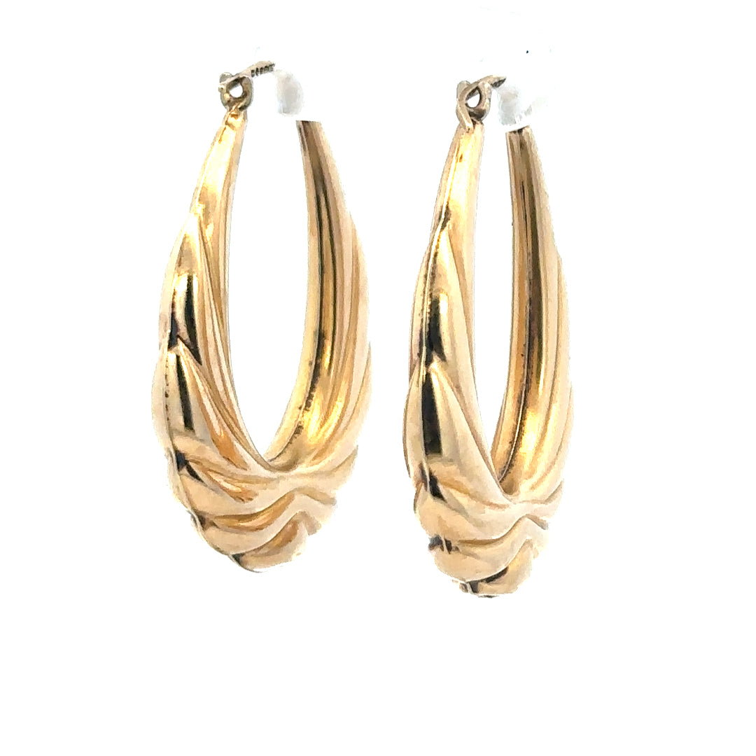 9ct yellow gold hoop earrings weighing 3.8g, unbranded, displayed on a neutral background showcasing their simple, elegant design.