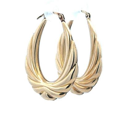9ct yellow gold hoop earrings weighing 3.8g, stylish unbranded earrings with a classic circular design.