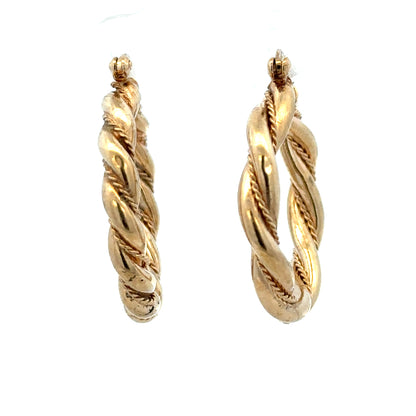 9ct yellow gold hoop earrings weighing 4.9g, featuring a classic circular design and polished finish.