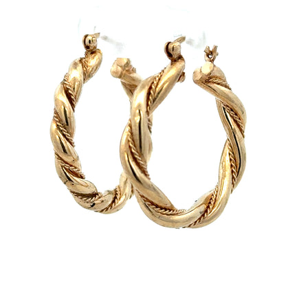 9ct yellow gold hoop earrings, unbranded, 4.9g, classic circular design, shining polished finish, shown on a white background.