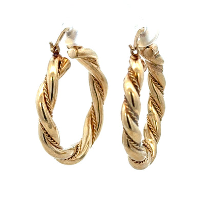 9ct yellow gold hoop earrings weighing 4.9g, unbranded with a classic circular design, shown close-up.