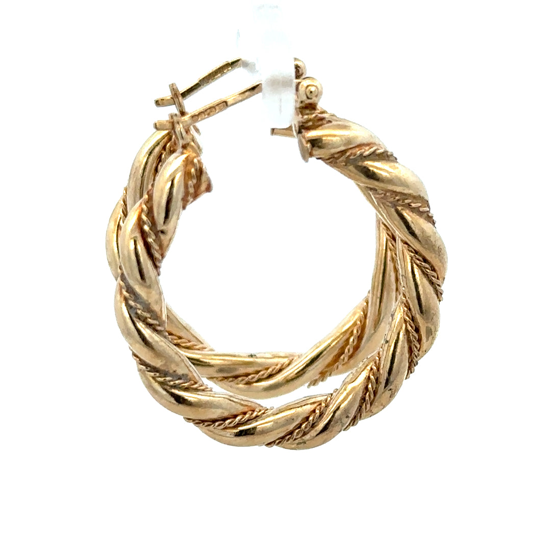 9ct yellow gold hoop earrings weighing 4.9g, unbranded, with a classic circular design, shown on a plain background.
