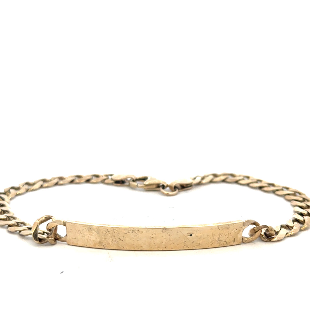 9ct yellow gold ID bracelet with a sleek design, featuring a polished surface and secure clasp, weighs 11.6g.