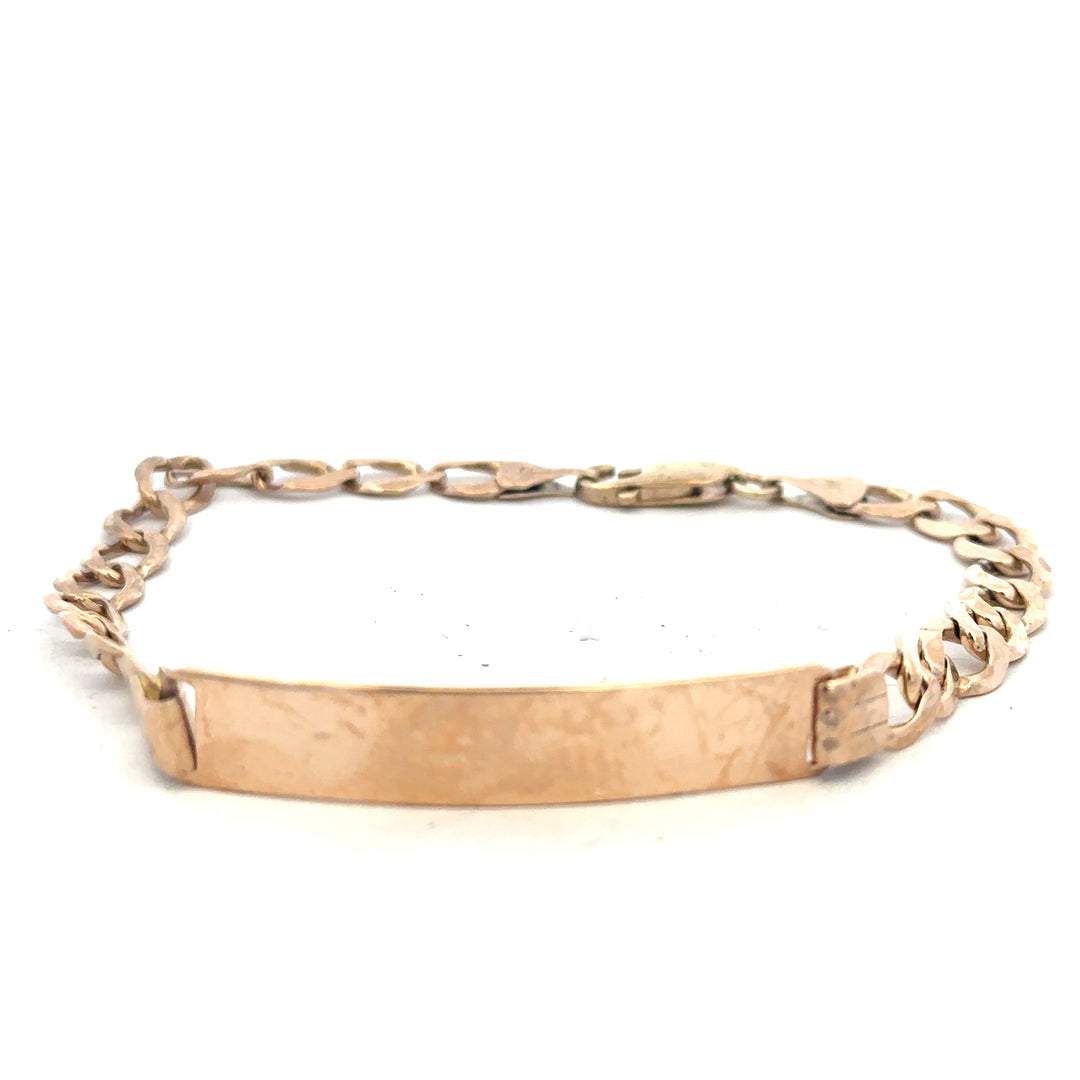 9ct yellow gold ID bracelet with a polished finish, weighing 9.7 grams, featuring a sleek, unbranded design.