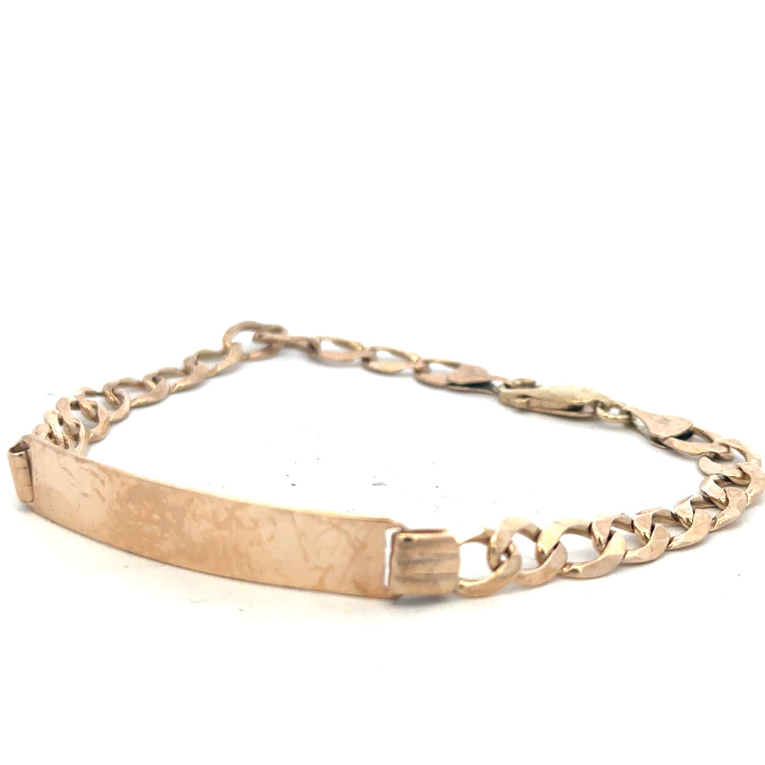 9ct yellow gold ID bracelet weighing 9.7g, unbranded, with a sleek design and polished finish, visible in the image.