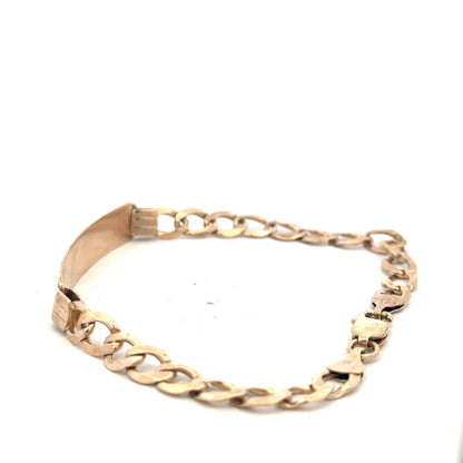 9ct yellow gold ID bracelet weighing 9.7g, unbranded, with a sleek design and secure clasp, shown on a neutral background.