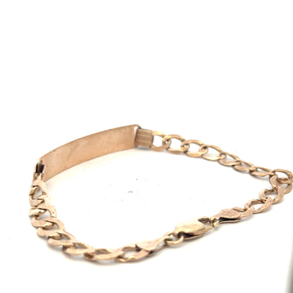 9ct yellow gold ID bracelet weighing 9.7g with a sleek, polished finish, featuring a secure clasp and smooth design.