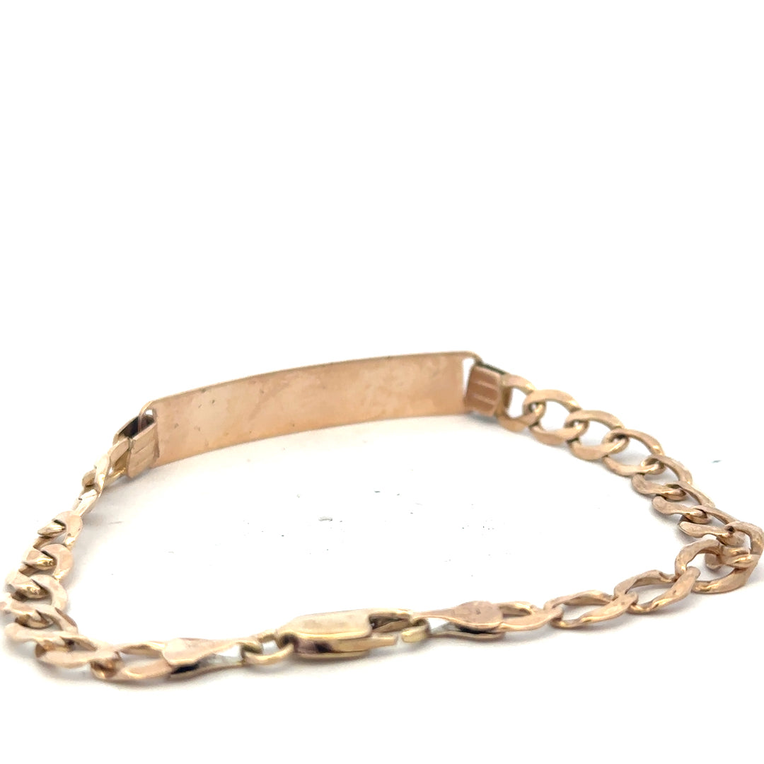 9ct yellow gold ID bracelet weighing 9.7g with a sleek design, unbranded, displayed on a neutral background.