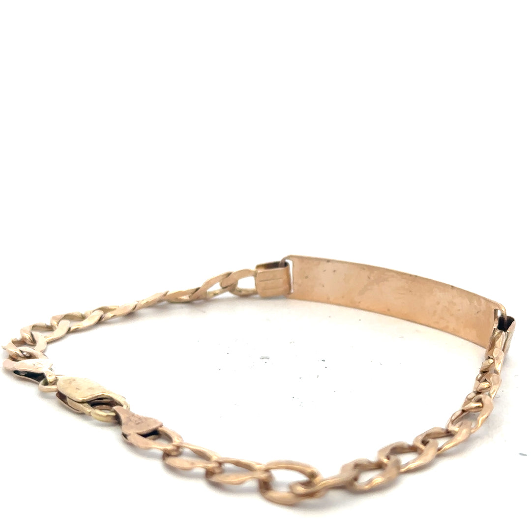 9ct yellow gold ID bracelet with a sleek design, weighing 9.7g, featuring a smooth, polished surface and a secure clasp.