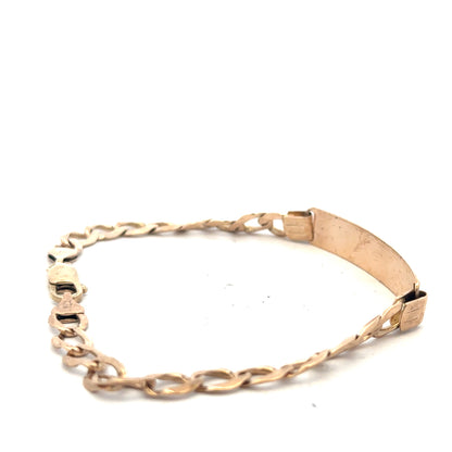 9ct yellow gold ID bracelet with a sleek design, weighing 9.7 grams, displayed on a neutral background