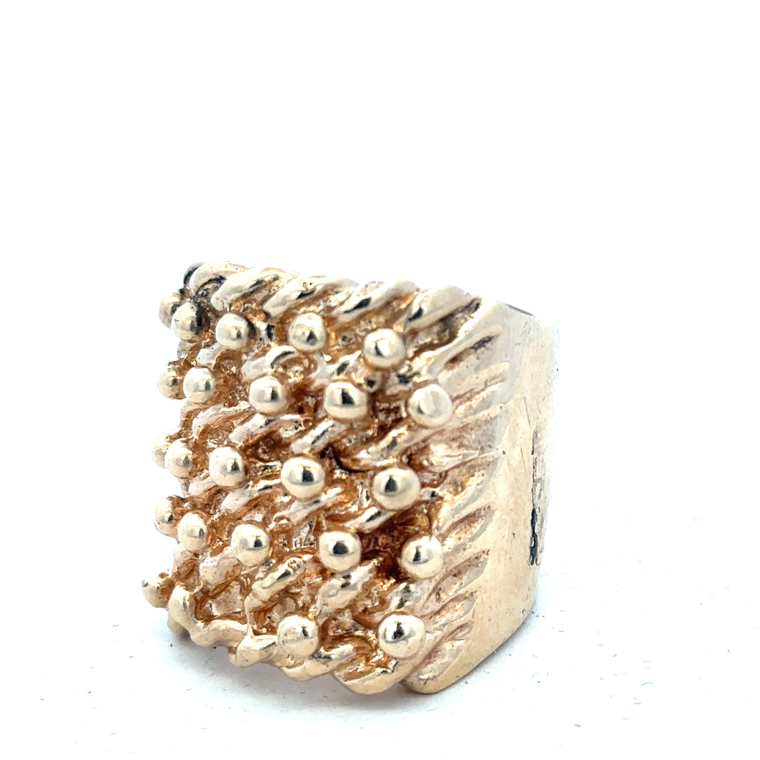9ct yellow gold keeper ring, unbranded with a polished band, shown in a close-up image highlighting its design and gold finish.