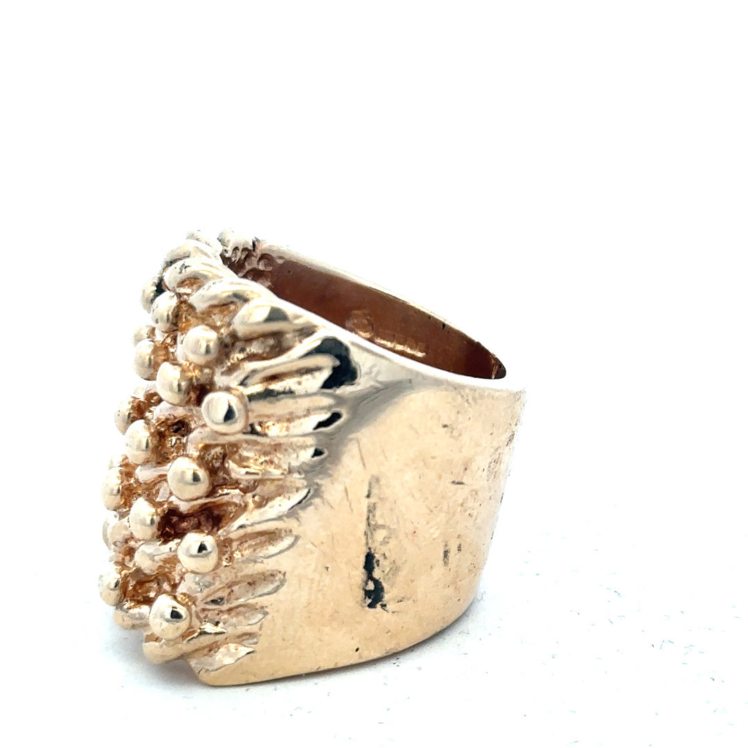 9ct yellow gold keeper ring with detailed band design, weighing 61.1g, unbranded, shown in close-up on a plain background.