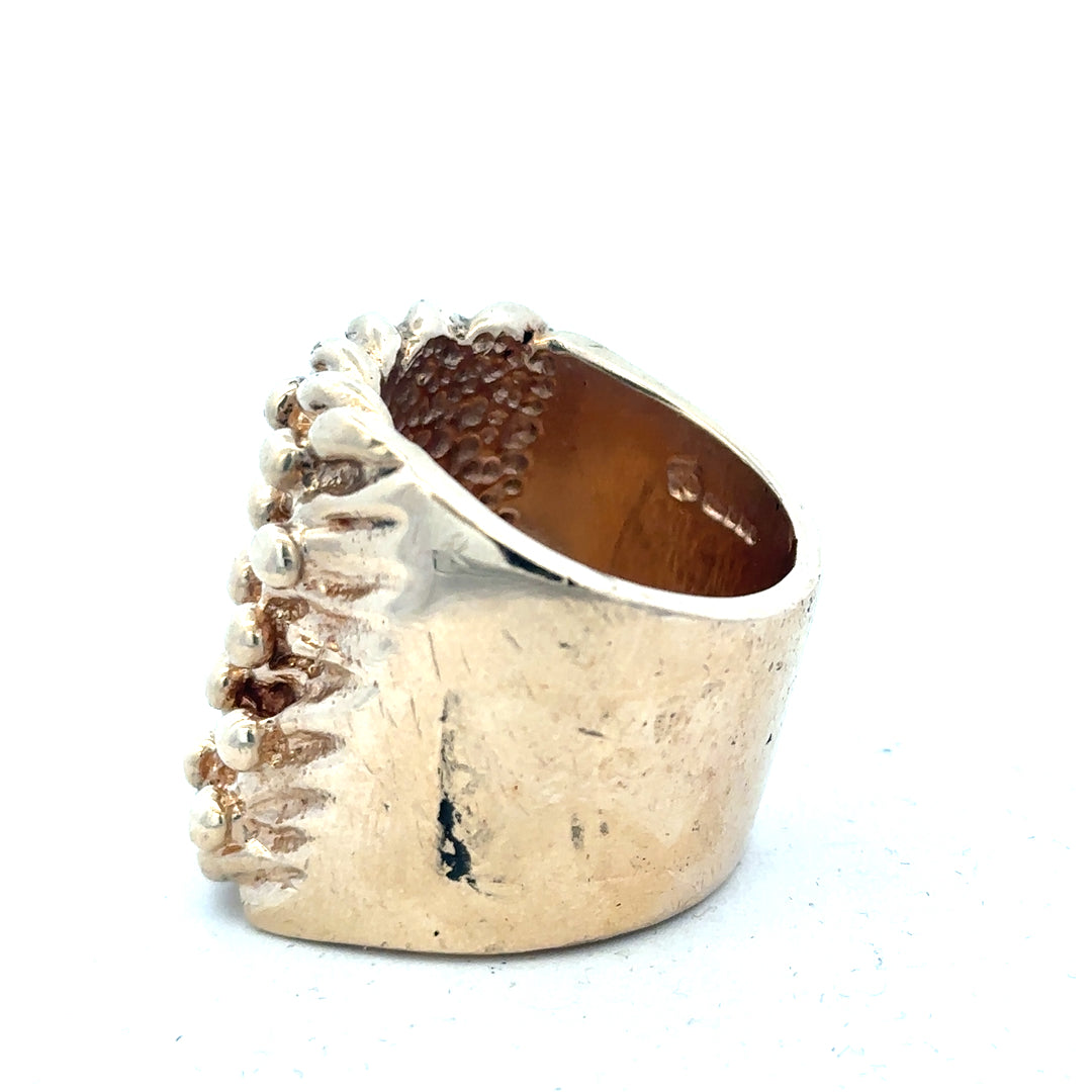 9ct yellow gold keeper ring with a polished finish, featuring a broad band and secure keeper design.