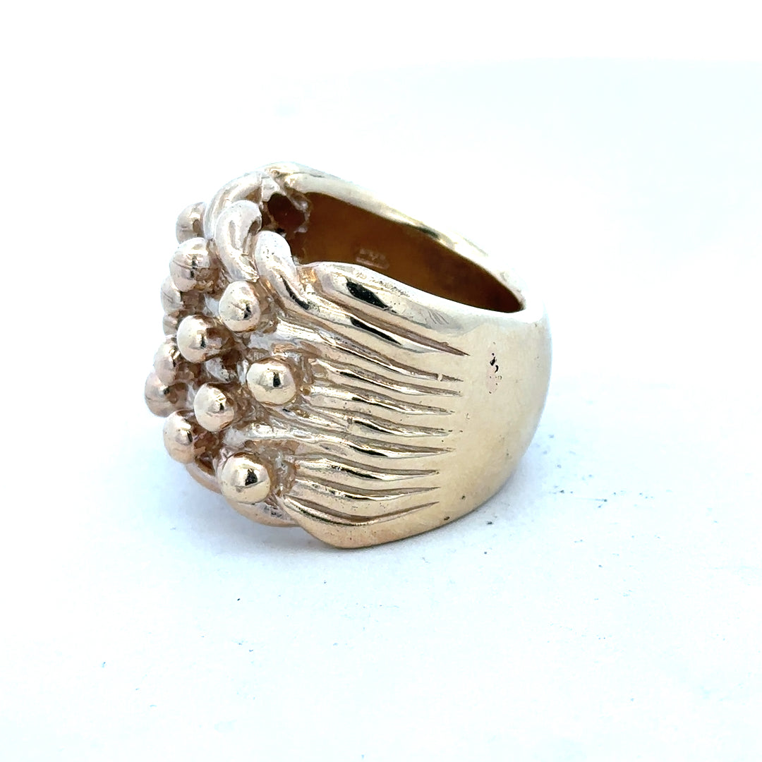 9ct yellow gold keeper ring in size W, unbranded, with a smooth band and secure clasp, showcasing elegant jewelry craftsmanship.