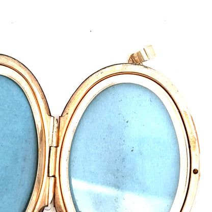 9ct yellow gold locket pendant, unbranded, featuring a classic design and weighing 13.8g, displayed against a neutral background.