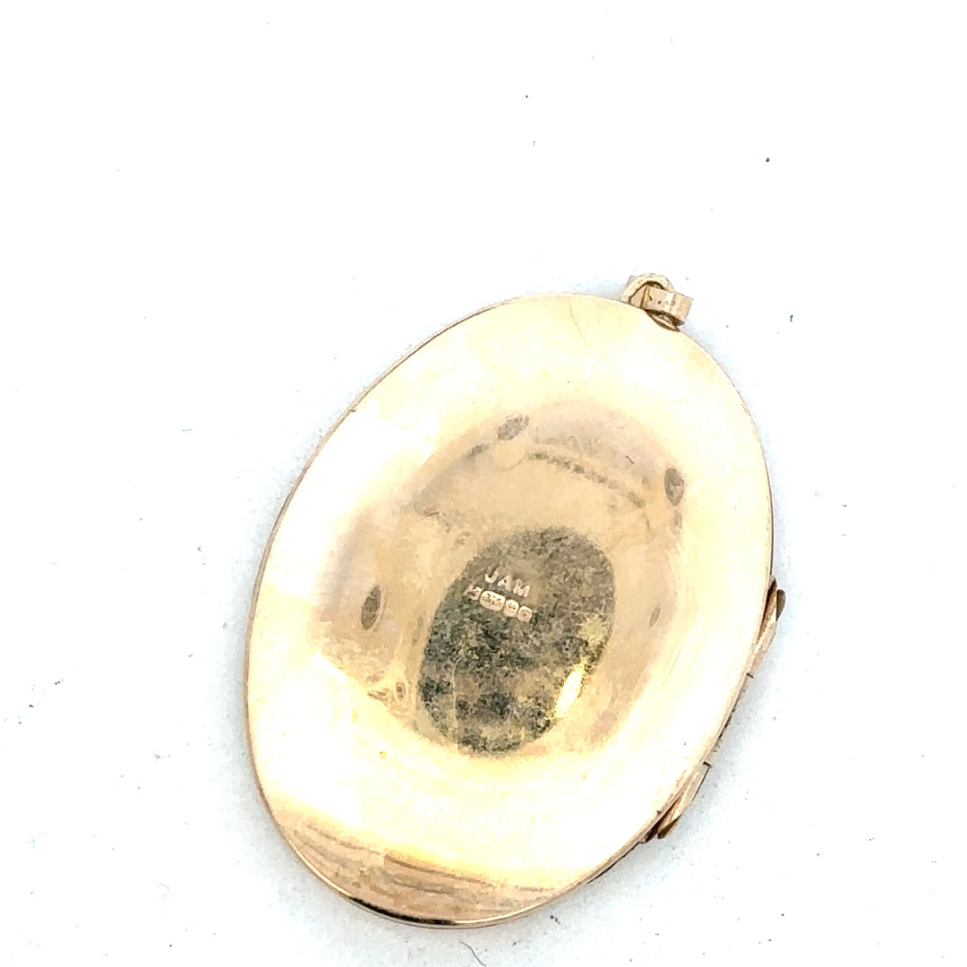 9ct yellow gold locket pendant with intricate design, weighs 13.8g, showcasing a classic jewelry piece.