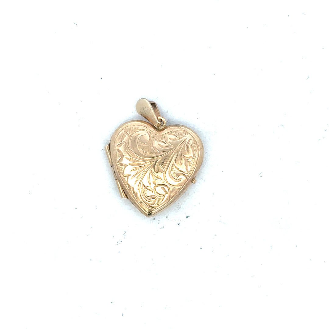 9ct yellow gold locket pendant, unbranded, 2.5g, detailed close-up of classic jewelry design with a smooth finish.