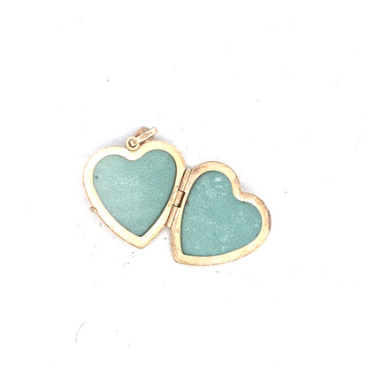 9ct yellow gold locket pendant, unbranded, lightweight jewelry piece with intricate design, weighing 2.5 grams.