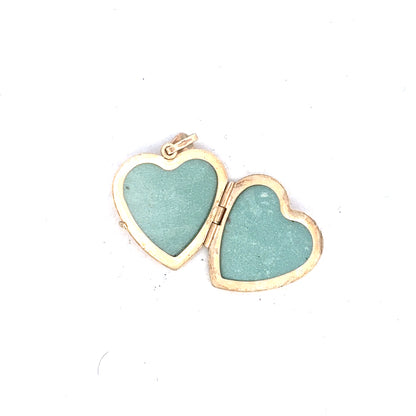 9ct yellow gold locket pendant, unbranded, weighing 2.5g, with intricate design, displayed against a neutral background.