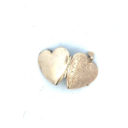 9ct yellow gold locket pendant, unbranded, weighing 2.5 grams, featuring a classic design with a polished finish.