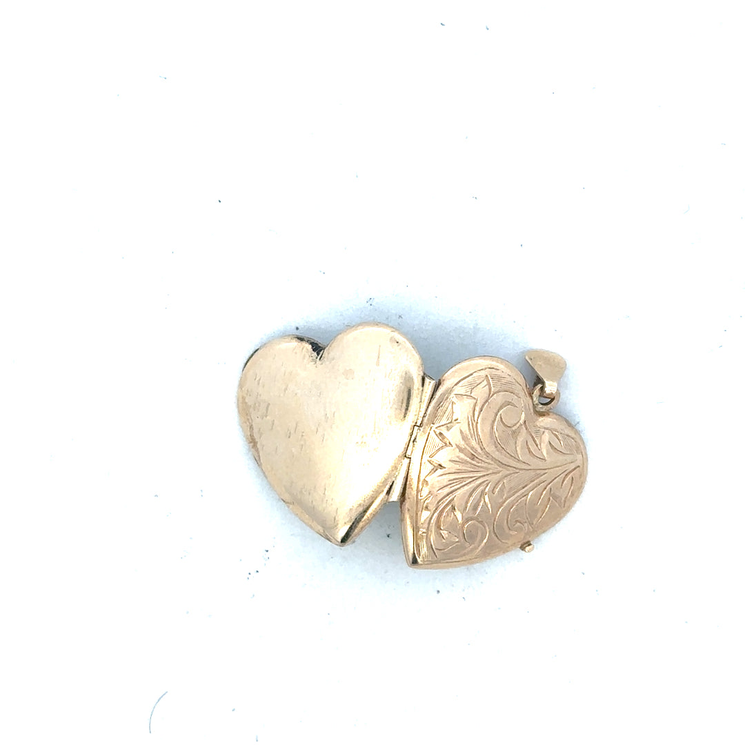 9ct yellow gold locket pendant, unbranded, weighing 2.5g, with detailed design visible in the image.