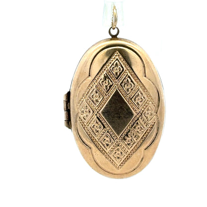 9ct yellow gold locket pendant, unbranded, weighing 5.8g, featuring a smooth, polished surface and classic design.