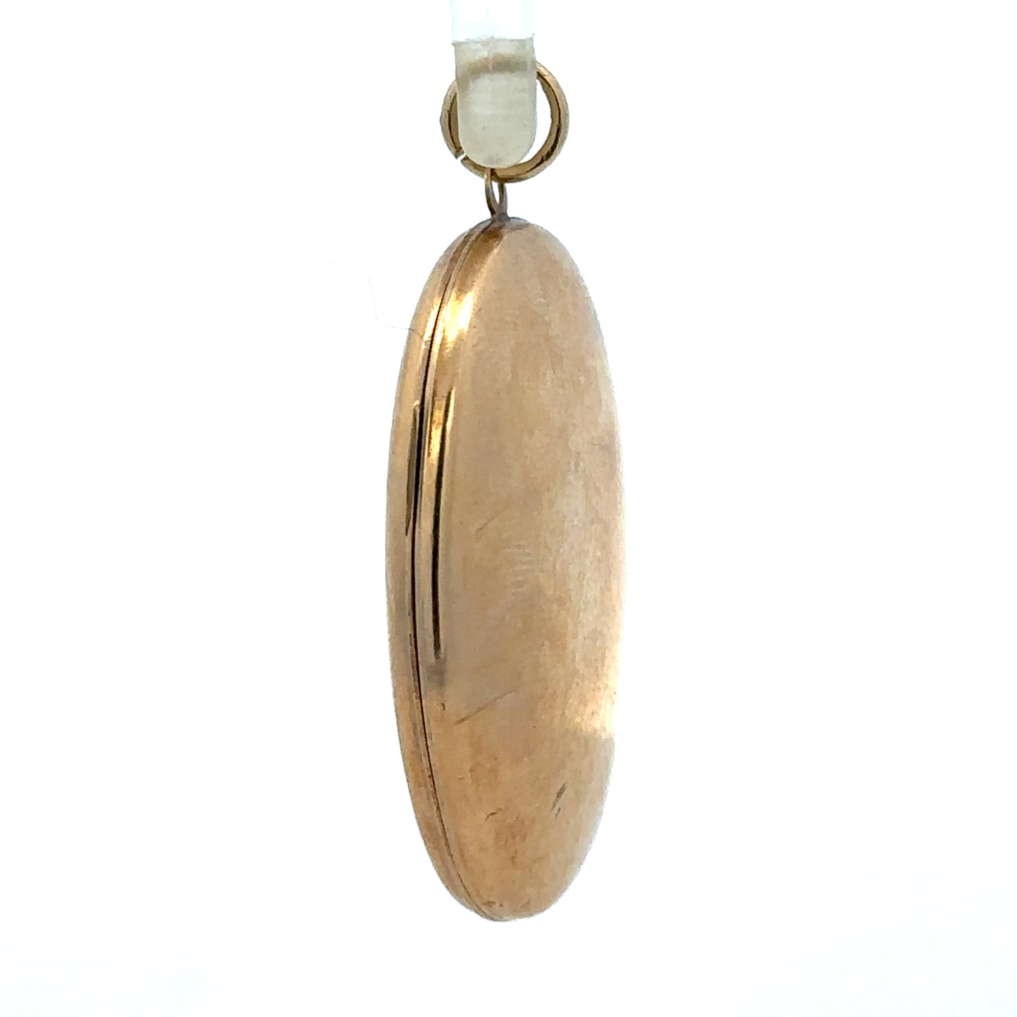 9ct yellow gold locket pendant showing intricate design and polished surface, weighing 5.8 grams, unbranded jewelry accessory.