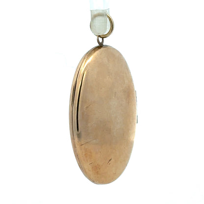 9ct yellow gold locket pendant, unbranded, with a 5.8g weight, featuring a classic design with a polished finish.