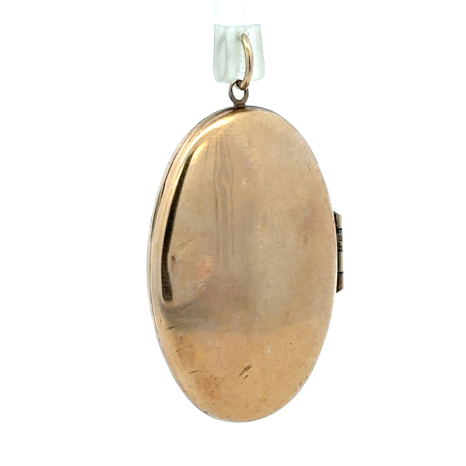 9ct yellow gold locket pendant, unbranded, weighing 5.8g, featuring intricate design and classic style, displayed against a plain background.