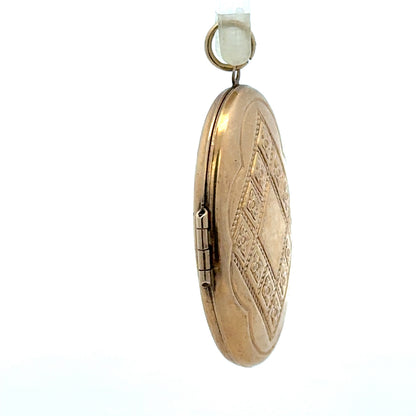 9ct yellow gold locket pendant, unbranded, weighing 5.8g, showcasing intricate design and polished finish for elegant jewelry.