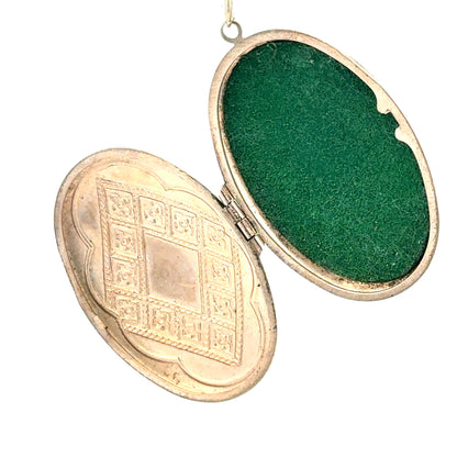 9ct yellow gold locket pendant, unbranded, weighing 5.8g, displayed with intricate design on a neutral background.