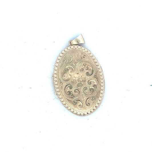 9ct yellow gold locket pendant with intricate design, weighs 6.3g, unbranded jewelry piece with a classic pendant style.