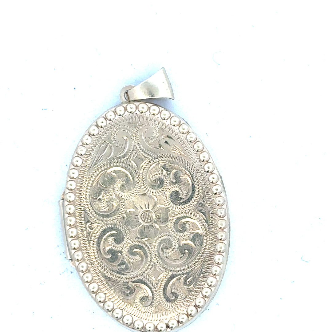 9ct yellow gold locket pendant displaying intricate design, weighs 6.3 grams, unbranded jewelry accessory with a polished finish.