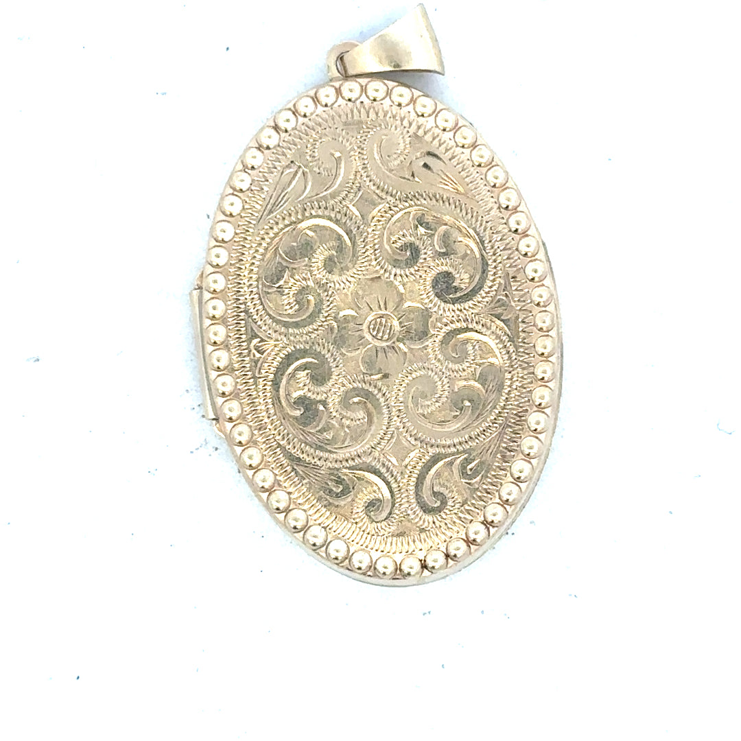 9ct yellow gold locket pendant with a polished finish, weighs 6.3g, designed for women, unbranded jewelry accessory.