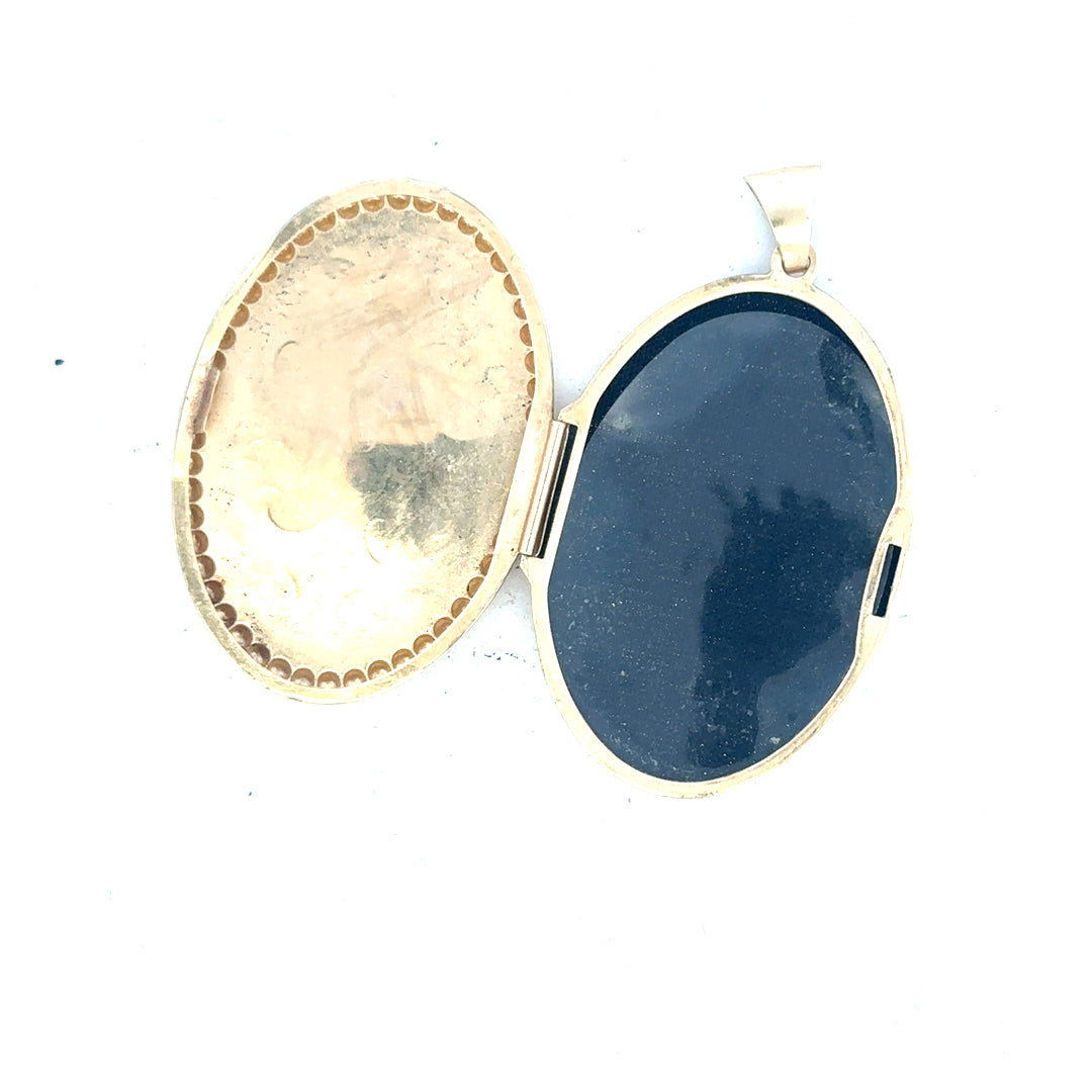 9ct yellow gold locket pendant showcasing a polished design, weighing 6.3g, unbranded jewelry accessory for necklaces.
